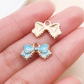 Lake blue bow-knot heart charm in gold finish with enamel detail for DIY jewelry - Bow Style (11032)
