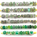 Macro view of green DIY charm beads featuring glass patterns and silver floral pendants - Pandora Style Beads / 40 Pcs Pack (Approx 70g) / Green