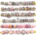 Detailed view of pink glass beads and silver charms with heart and floral patterns - Pandora Style Beads / 40 Pcs Pack (Approx 70g) / Pink