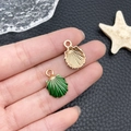 Detail of green enamel shell pendants with golden textured back for jewelry making - Enamel Green Shell (8606)