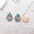 Blue enamel Easter egg charms with pink stripes and heart patterns for DIY jewelry making - Heart Pattern Egg
