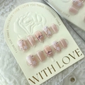 Pink cat eye press-on nails with star patterns and rhinestones on display card - L / Star Pink