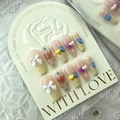 Unghie finte fatte a mano con cuori e fiocchi 3D in colori pastello stile caramella - Cuore Crema / Grande (L)