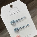 Handmade blue glitter press-on toe nails on a white card with metal ring buckle - S / Blue Sequin