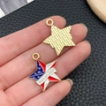 Detail of 4th of July star pendants with American flag enamel held in hand for size - KC Gold Blue White Red Enamel Alloy July 4th Star