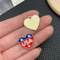 Macro shot of heart-shaped USA flag charms with red white blue enamel and gold back - KC Gold Blue White Red Enamel Alloy Heart USA