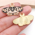Macro shot showing front and back details of enamel butterfly charms with gold finish - Black Green Pink Rose Butterfly (18777)