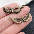 Detail of vintage bronze mask charms for DIY jewelry making and Halloween crafts - Halloween Medium Mask (1620) / 12x31