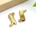 Detail of gold cowboy boot pendants showing intricate Western relief and metallic finish - Gold Stainless Steel Textured Cowboy Boot (T2787)