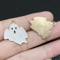 Macro view of Halloween ghost charms showing enamel face and textured gold metal back - White Scary Ghost (15126)