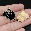Detailed macro view showing the front and back of a ghost charm with black enamel and gold metal - Black Scary Ghost (15127)