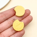 Close-up of yellow resin cookie keychain charm with bitten design and metal ring - Yellow Letter Sandwich Cookie