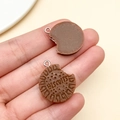 Macro view of resin sandwich biscuit pendants showing texture and bite mark detail - Brown Letter Sandwich Cookie