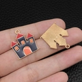 Enamel witch castle charm in black and orange with gold finish and sunburst back - Red Black Haunted House (15138)