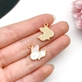 Close-up of cute enamel bunny charms with pink ears and golden grid back on a palm - Enamel Rabbit Pendant (23085) / 1 Piece/Pack (16x15mm) / Pink Ear White