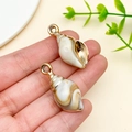 Laser-plated acrylic shell pendants in white and brown with golden metal loops - Laser Plated Gold Beige Ocean Conch (23613)