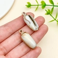 Acrylic seashell pendants with gold loops featuring brown and white textures for DIY crafts - Laser Plated Gold Beige Ocean Conch (23614)