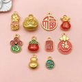Detailed view of Chinese style enamel pendants with traditional fortune bag and peanut shapes - Enamel Antique Gold Matte Fu Bag Set (SN1183)