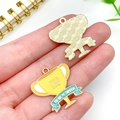 Detail view of gold trophy alloy pendant with DAD engraving for Father's Day jewelry making - Yellow Trophy Style (23493)