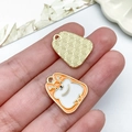 Detailed view of enamel cartoon dog pendants showing textured golden metal back and size - Gold Base Orange White Cartoon Dog (23490)