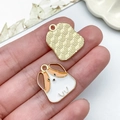 Macro view of cartoon dog charms showing detailed enamel front and textured gold alloy back - Gold Base White Cartoon Dog Type B (23487)