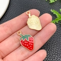 Close-up of strawberry enamel charms showing red drip oil finish and gold metal back - KC Gold Red Enamel Fruit Strawberry (23441) / 24x14x1mm
