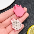 Macro shot of realistic dragon fruit resin charms for DIY jewelry and accessory making - Fruit