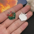 Green heart-shaped enamel Christmas charm with reindeer pattern and Merry Christmas text - Green Heart Shaped Christmas Reindeer (19660) 23x22mm