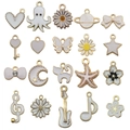 White enamel and gold-plated alloy charms in shapes of butterfly, moon, and starfish - White Series Mixed Style