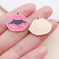 Detail of pink lip-shaped alloy pendant with black bat motif and gold textured backing - 20x23mm / Pink Rose Red Lethal Lips (25029)