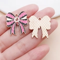 Detailed view of pink ghost bow alloy pendant with enamel finish and gold textured back - 25x22mm / Pink Rose Red Evil Eye Bowknot (25027)