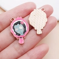 Macro detail of enamel rose pink hand mirror pendants with blue zombie girl design - 27x17mm / Pink Rose Red Mirror Zombie (25024)