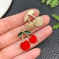 Enamel cherry charms for jewelry making with red and green finish on black background - Enamel Red Fruit Cherry (21360) / 22x21mm