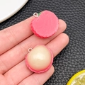 Resin lychee pendant charms featuring pink shells and white fruit pulp details - Lychee