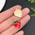 Pair of strawberry enamel alloy pendants with red finish and textured golden metal back - KC Gold Red Enamel Fruit Strawberry (23386) / 20x14x2mm