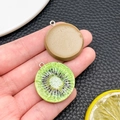DIY kiwi resin charms showing realistic green fruit slice and brown textured peel - Kiwi