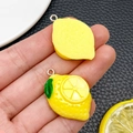 DIY yellow resin lemon slice pendant with green leaf and silver metal ring for crafts - Lemon