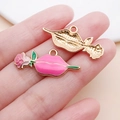 Pink lips and rose enamel alloy pendant showing both front and golden textured back - 13x30mm / Pink Lips Biting Rose (21189)