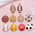 Macro shot of 10 sport themed charms including football, soccer, basketball and baseball - Enamel Rhinestone Sports 10 Piece Set