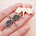 Detailed view of gothic dragon moon bat charms with black gold stars and textured gold back - Star Bat Style (25224)