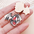 Detail of gothic dragon enamel pendants with red floral pattern and textured gold back - Floral Western Flying Dragon Style (25222)