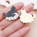 Hand holding black enamel cat charms with gold moon and star details for DIY jewelry - 1个装 (28x27mm)