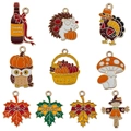 Set of 10 autumn enamel charms featuring maple leaves, hedgehogs, and pumpkins for DIY jewelry - Thanksgiving Series Assorted (SN1610)