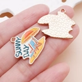 Detail of Sunny Day beach charm showing the enamel front and metal textured back - Yellow Beach Umbrella Style