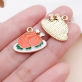 Detailed macro view showing the enamel roast turkey charm and its gold honeycomb texture back - Orange Drip Oil Turkey Platter Charm (25059) / 17x21x2mm