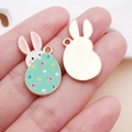 Detailed front and back view of Easter bunny and green dotted egg alloy pendant for DIY jewelry - Green Easter Spotted Bunny Egg (25139)