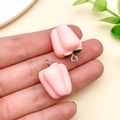Macro view of pink bell pepper resin pendants with silver metal rings for DIY crafts - Pink (24127)