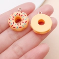 Detailed macro view of miniature resin donut charms with colorful sprinkles for DIY crafts - Yellow Resin Round Donut (17186)