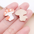 Macro view of orange mushroom charm showing detailed enamel front and textured back - 23x18mm White Enamel Zinc Alloy Mushroom (25229)