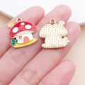 Macro shot of colorful enamel mushroom pendant held in hand for DIY jewelry making - 20x17.5mm Red Enamel Zinc Alloy Mushroom House (25068)